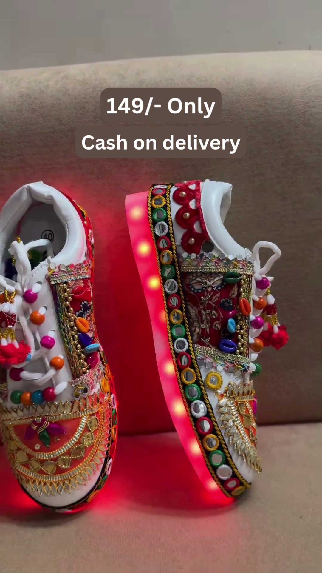 Unisex White Ethnic Mojari Footwear with Multicolor Bead Embroidery – Festive Pair with Red Light Showcase Styling